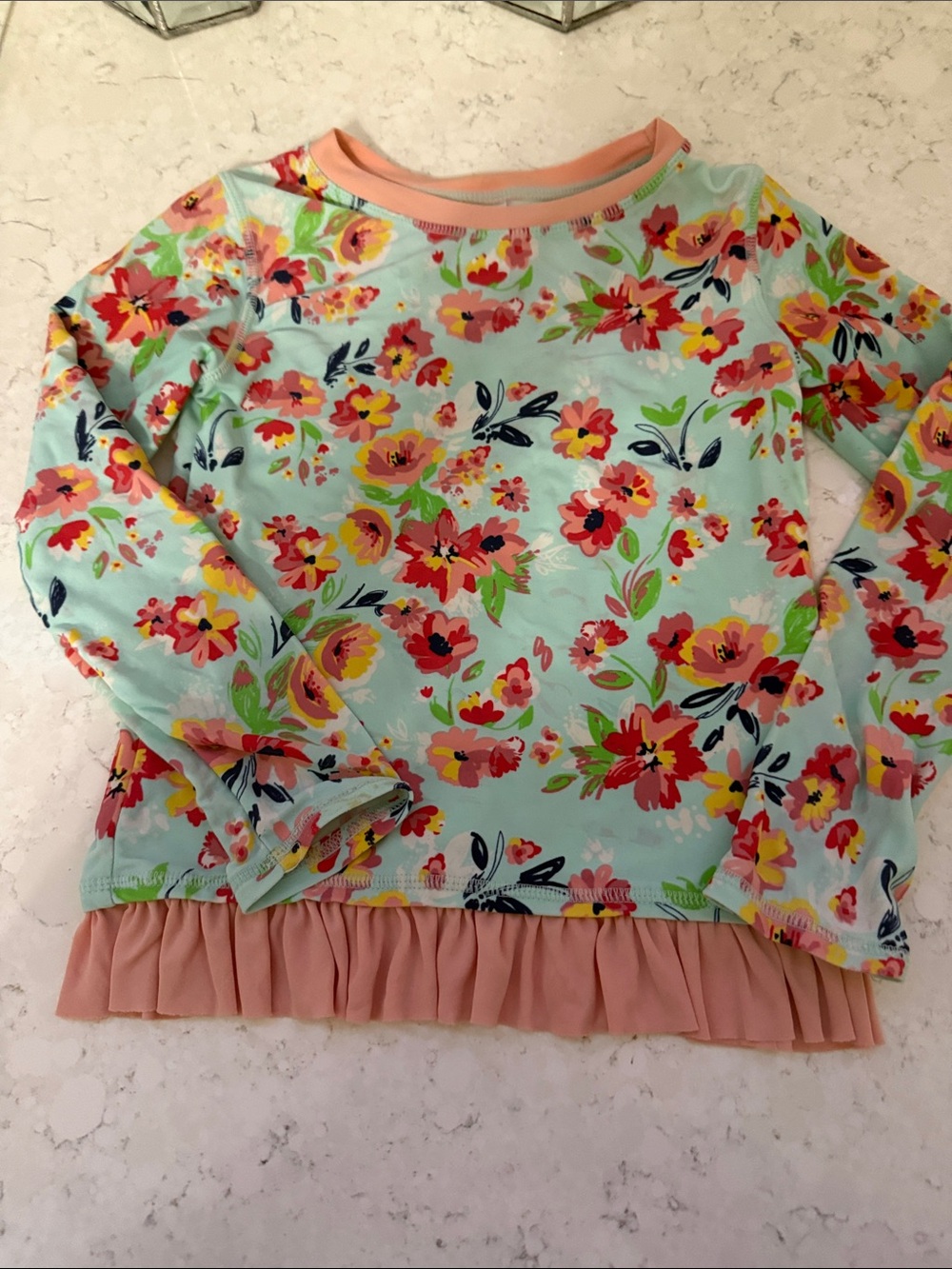 Ruffle Butts Floral Long-Sleeve Rashguard in Light Blue, Pink, Yellow, Green